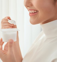 woman eating yogurt 