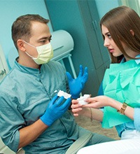 Patient in Prosper talking to dentist about dental implants