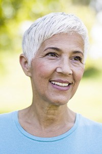 Older woman smiling outdoors