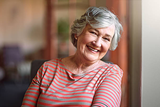 older person with dental implants smiling